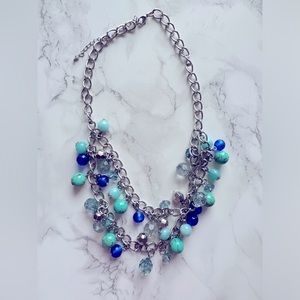 Shades of blue necklace adjustable closure.
